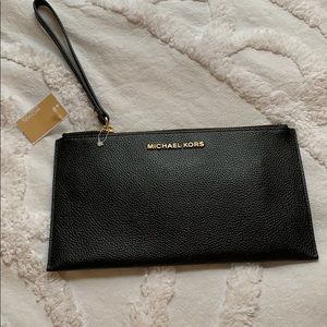 A Micheal Kors Hand clutch wristlet